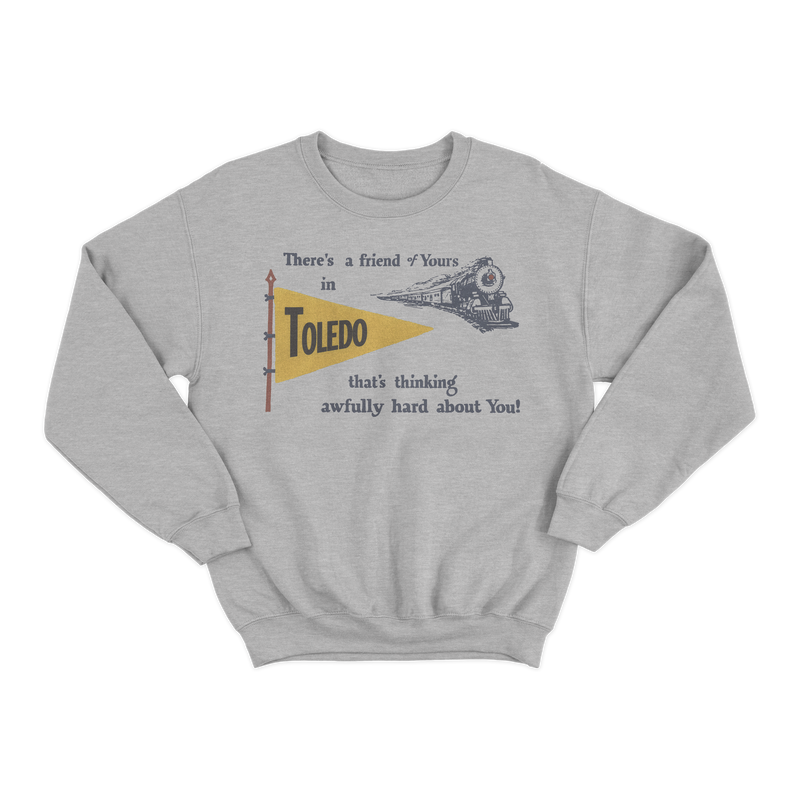 a grey sweatshirt with a flag and a bird